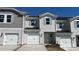Charming townhome with white siding, attached garage, and well-maintained landscaping at 2060 Old Rivers Rd, Concord, NC 28027