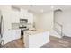 Stylish kitchen with white cabinets, stainless steel appliances and a granite topped island at 2060 Old Rivers Rd, Concord, NC 28027