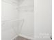 A walk-in closet featuring metal shelving for efficient and organized storage solutions at 2060 Old Rivers Rd, Concord, NC 28027