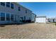 View of a large backyard with an outdoor seating area and a storage shed at 2097 Saddlebred Dr, Iron Station, NC 28080