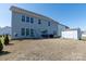 Spacious backyard featuring a patio area, storage shed, and room for outdoor activities at 2097 Saddlebred Dr, Iron Station, NC 28080