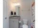 Well-lit bathroom with a granite countertop vanity and a decorative shower curtain at 2097 Saddlebred Dr, Iron Station, NC 28080