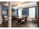 Formal dining room with coffered ceilings, hardwood floors, and a large table at 2097 Saddlebred Dr, Iron Station, NC 28080