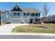 Beautiful two-story home featuring a two-car garage, manicured lawn, and traditional design at 2097 Saddlebred Dr, Iron Station, NC 28080