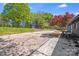 Backyard with shed and concrete driveway on a sunny day at 2109 Tarlton Dr, Matthews, NC 28105