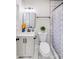 Well-lit bathroom with a black framed mirror, white vanity, and patterned shower curtain at 2109 Tarlton Dr, Matthews, NC 28105