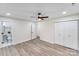 A bedroom offers vinyl floors, large closets, ceiling fan and a view to the bathroom at 2109 Tarlton Dr, Matthews, NC 28105