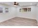 A bedroom is well-lit from two windows and features a modern ceiling fan at 2109 Tarlton Dr, Matthews, NC 28105