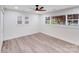 Bedroom with a ceiling fan and two windows that bring in natural light at 2109 Tarlton Dr, Matthews, NC 28105