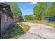 Long concrete driveway leads to the house on a sunny day at 2109 Tarlton Dr, Matthews, NC 28105