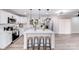Bright, white kitchen featuring a large center island with seating and modern stainless steel appliances at 2109 Tarlton Dr, Matthews, NC 28105