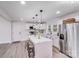Modern kitchen featuring a center island with seating, white cabinets, and stainless steel appliances at 2109 Tarlton Dr, Matthews, NC 28105
