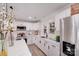 Bright kitchen featuring white cabinets, black hardware, and stainless steel appliances at 2109 Tarlton Dr, Matthews, NC 28105
