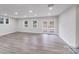 Large living room with recessed lighting and two windows providing natural light at 2109 Tarlton Dr, Matthews, NC 28105