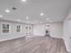 Large living room with recessed lighting and French doors leading to the outdoors at 2109 Tarlton Dr, Matthews, NC 28105