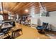Finished basement with wood ceilings, concrete floor, and office setup with desk and chair at 237 Palaside Ne Dr, Concord, NC 28025