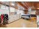 Finished basement with wood ceilings, exposed pipes, concrete floor and full size bed at 237 Palaside Ne Dr, Concord, NC 28025