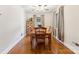 Bright dining room with hardwood floors and a classic dining set, perfect for entertaining at 237 Palaside Ne Dr, Concord, NC 28025