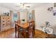 Elegant dining room with hardwood floors, a classic dining set, and a display cabinet at 237 Palaside Ne Dr, Concord, NC 28025