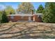 Charming brick home with well-maintained landscaping and inviting front porch at 237 Palaside Ne Dr, Concord, NC 28025