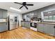 Spacious kitchen with stainless steel appliances, hardwood floors, and ample counter space at 237 Palaside Ne Dr, Concord, NC 28025
