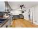 Modern kitchen featuring granite countertops, hardwood floors, and lots of natural light at 237 Palaside Ne Dr, Concord, NC 28025