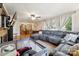 Open-concept living room and dining area featuring hardwood floors and lots of natural light at 237 Palaside Ne Dr, Concord, NC 28025