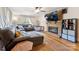 Inviting living room with a brick fireplace, hardwood floors, and comfortable seating at 237 Palaside Ne Dr, Concord, NC 28025
