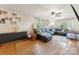 Cozy living room with plush seating, natural light, and hardwood floors at 237 Palaside Ne Dr, Concord, NC 28025