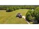 Expansive aerial shot of a secluded home, highlighting its large lot, surrounding greenery, and private driveway at 244 Alexis Lucia Rd, Alexis, NC 28006