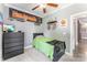 Cozy bedroom with ceiling fan, sports decor, neutral gray walls and green accents at 244 Alexis Lucia Rd, Alexis, NC 28006