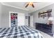 This bedroom offers a ceiling fan, black dresser and decor at 244 Alexis Lucia Rd, Alexis, NC 28006