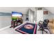 This bonus room includes a television, couch and chair at 244 Alexis Lucia Rd, Alexis, NC 28006