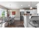 Bright and airy dining room with a stylish chandelier, elegant table setting, and view to kitchen at 244 Alexis Lucia Rd, Alexis, NC 28006