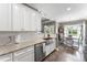 Spacious kitchen with stainless steel appliances, granite countertops, white cabinets, and a double sink at 244 Alexis Lucia Rd, Alexis, NC 28006