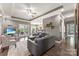 Open-concept living room showcasing modern furnishings, hardwood floors, and French doors leading to an outdoor space at 244 Alexis Lucia Rd, Alexis, NC 28006