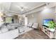 Modern living room with neutral tones, contemporary furniture, a ceiling fan, and an open layout to the dining area at 244 Alexis Lucia Rd, Alexis, NC 28006