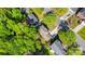 Aerial view of a charming suburban neighborhood with lush green trees and well-maintained lawns at 2512 Pimpernel Rd, Charlotte, NC 28213