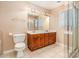Bright bathroom featuring a double vanity, a shower, and tiled flooring at 2512 Pimpernel Rd, Charlotte, NC 28213