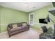 Cozy bedroom with a comfortable sofa, desk space, and natural light at 2512 Pimpernel Rd, Charlotte, NC 28213