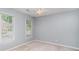 Bright bedroom with ample natural light coming through the windows and a ceiling fan at 2512 Pimpernel Rd, Charlotte, NC 28213