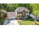Charming two-story home with brick and siding, complemented by a well-manicured lawn at 2512 Pimpernel Rd, Charlotte, NC 28213