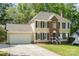 Inviting two-story home with a front-facing garage and a neatly landscaped front yard at 2512 Pimpernel Rd, Charlotte, NC 28213