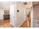 Hallway that connects the main living areas, staircase and the hardwood floor throughout the house at 2512 Pimpernel Rd, Charlotte, NC 28213