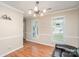 Bright living room features hardwood floors, two windows, and neutral paint at 2512 Pimpernel Rd, Charlotte, NC 28213
