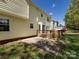 Exterior view of the home's back yard and the deck extending from the house at 2906 Crescent Knoll Dr, Matthews, NC 28105