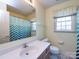 Bathroom featuring a single vanity, tile flooring, and shower with curtain at 2906 Crescent Knoll Dr, Matthews, NC 28105