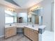Bathroom with dual vanity, tile flooring, and mirrors at 2906 Crescent Knoll Dr, Matthews, NC 28105