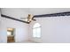 An empty bedroom with high ceilings, carpet, a ceiling fan, and a Palladian window at 2906 Crescent Knoll Dr, Matthews, NC 28105