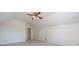 Attic bedroom with a ceiling fan and door that leads to another room at 2906 Crescent Knoll Dr, Matthews, NC 28105